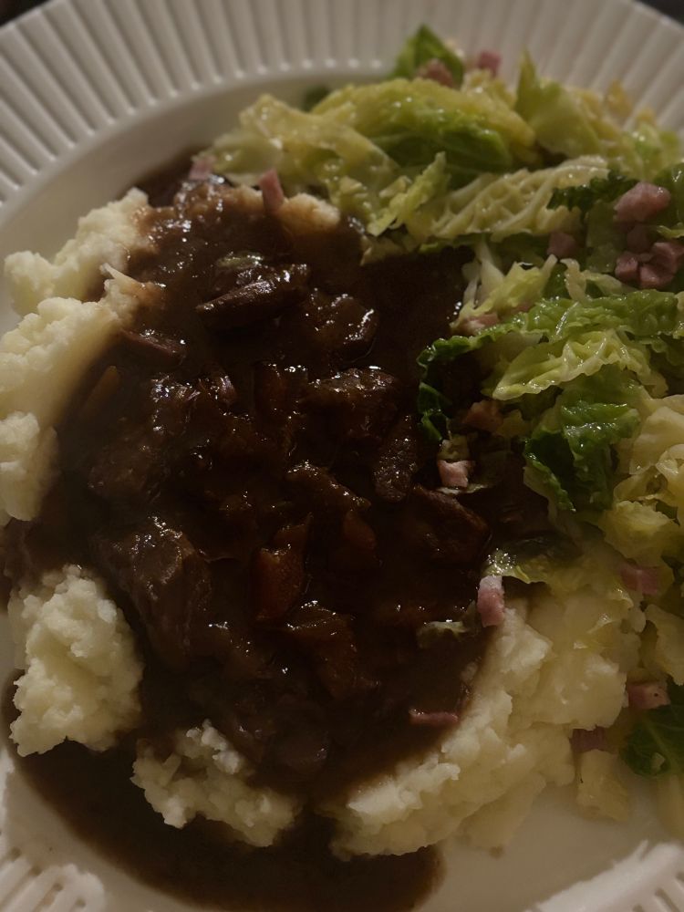 My dinner of creamy mashed spuds and a generous helping of steak&guinness casserole with a side of stir fried cabbage with lardons