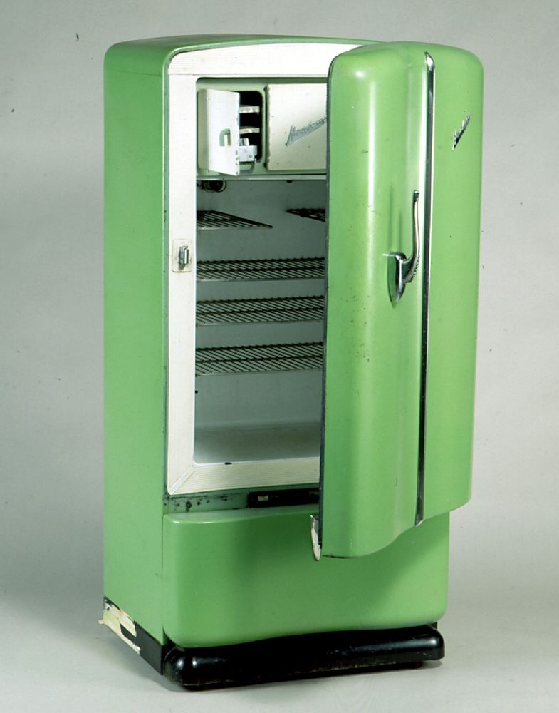 A picture of an old 60s style green Kelvinator fridge