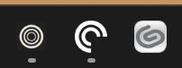 Screenshot. Image shows a small portion of a Windows taskbar, on which are three icons. In order, they're Zen browser's three nested white circles on a black background, Pocket Cast's two nested circles with a quarter chunk removed on a black background, and Clip Studio Paint's grey paperclip-like swirl on a white background.