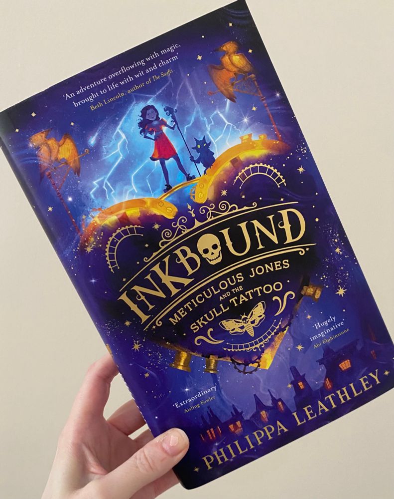 The purple hardback edition of Inkbound: Meticulous Jones and the Skull Tattoo by Philippa Leathley