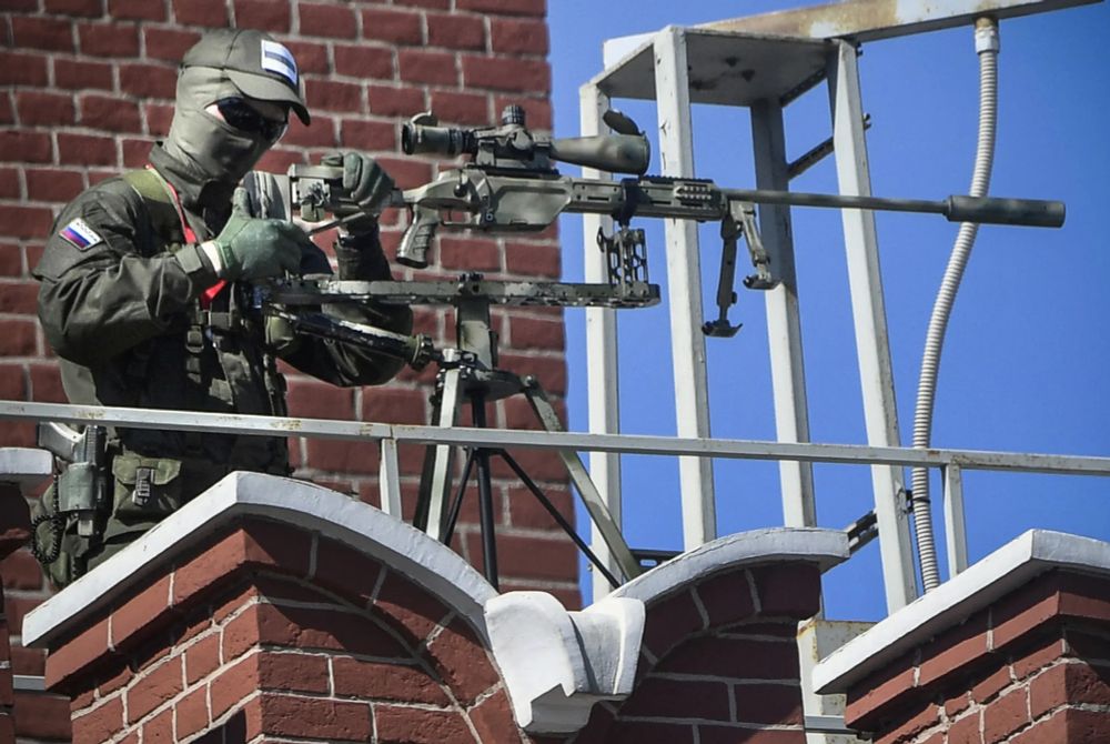 Russian sniper in the war against Ukraine on a rooftop.
