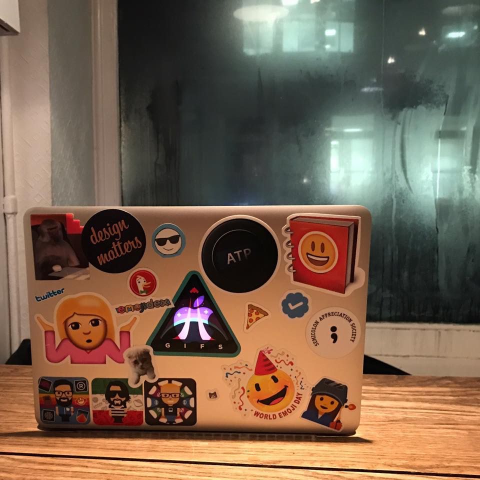 Back of laptop with stickers: Design Matters, Emojipedia, GIPHY, Relay FM, Twitter