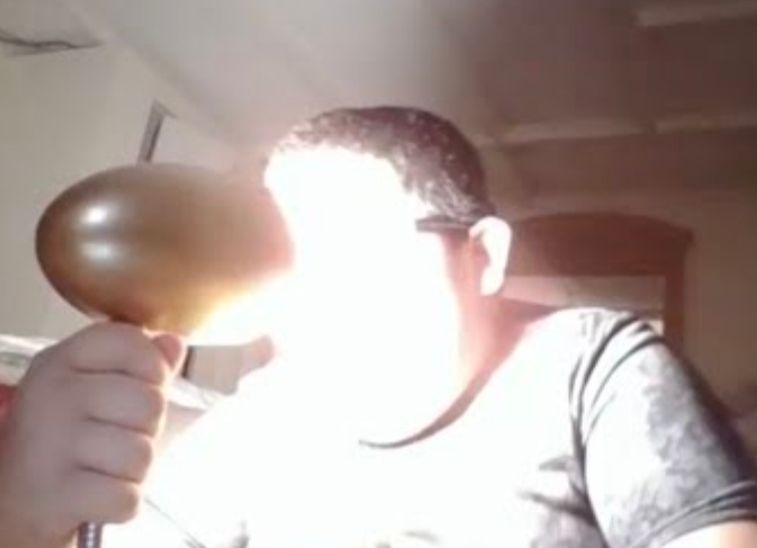 kid staring into a desk lamp