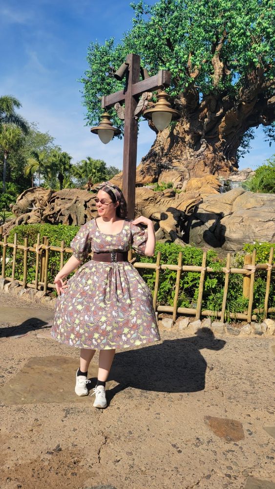 A mid twirl shot of me in front of the tree of life with my skirt in a perfect bell. 