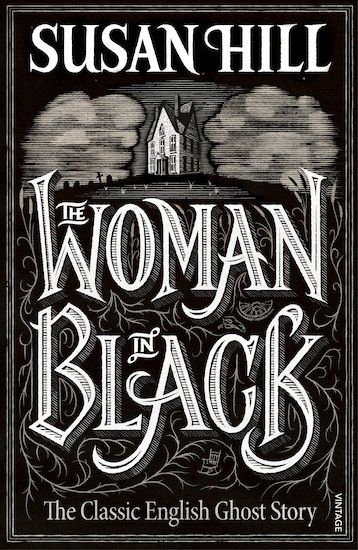 An image of The Woman in Black book cover. Black and white with an illustration of a house and the title prominently displayed 