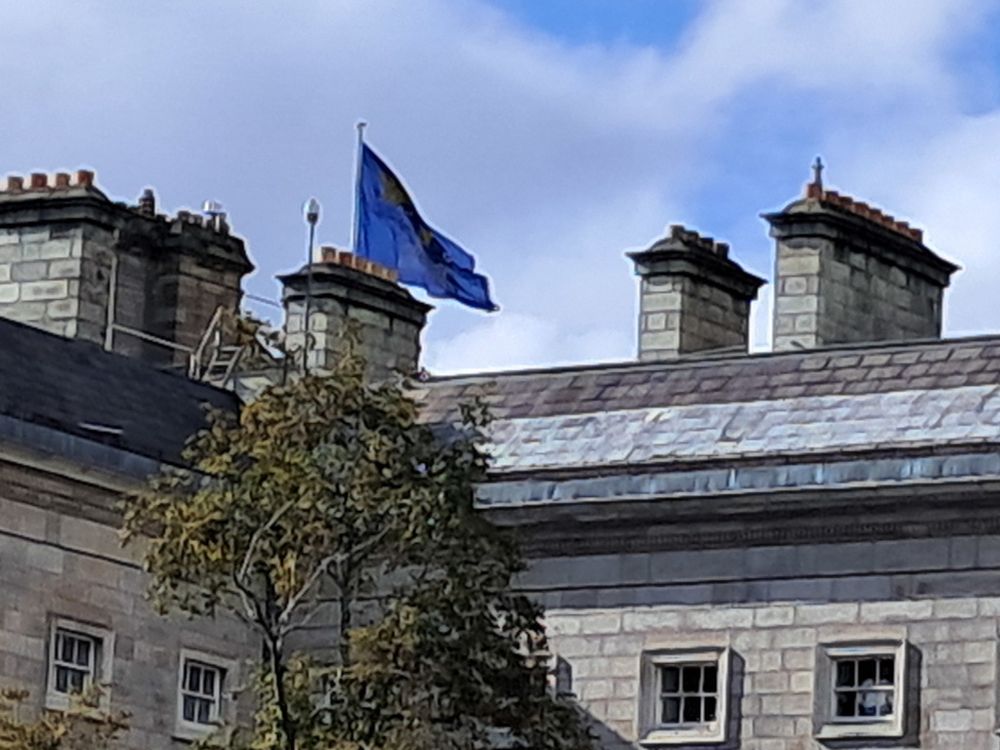 Flag of Trinity College Dublin flying at the southern end of the West Front of the College.