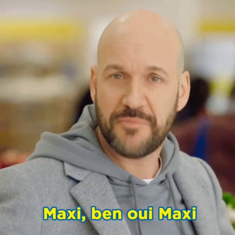 a man with a beard says maxi ben oui maxi in a foreign language