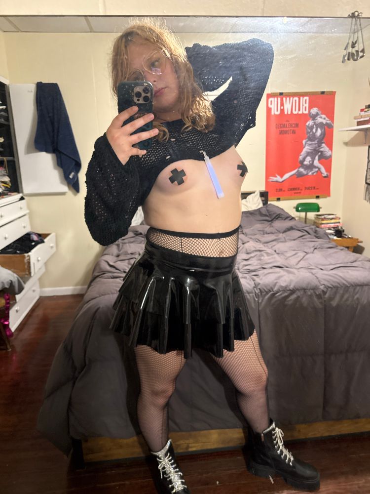 mesh crop top, fishnets, vinyl short skirt, pasties, boots with bedazzled laces, heart glasses, glow stick 