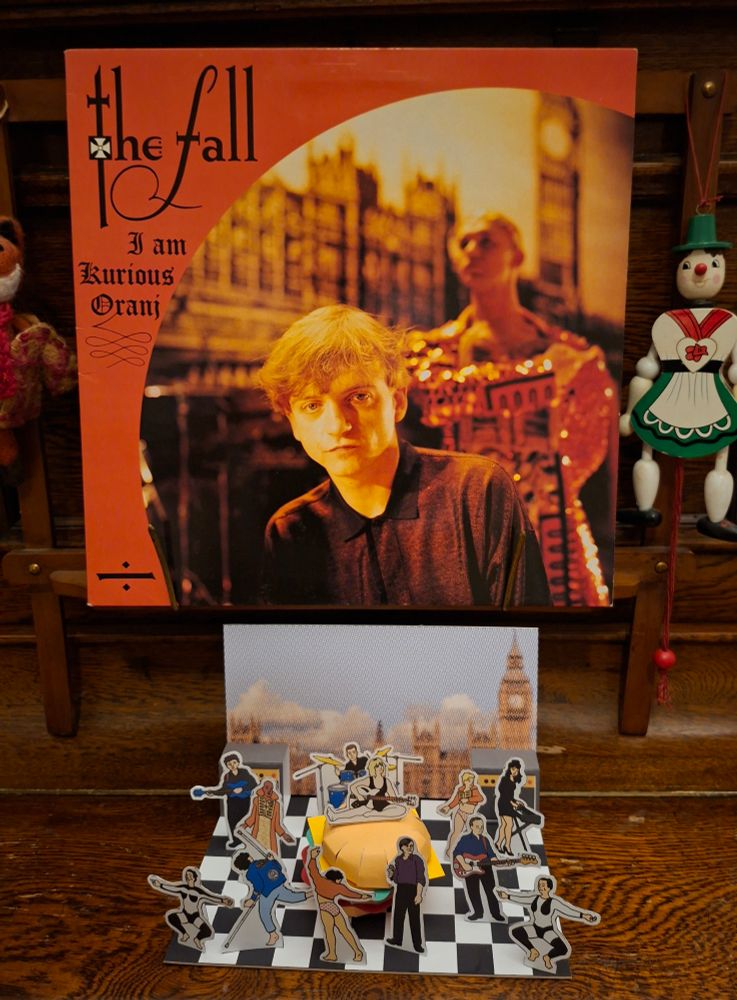 'I Am Kurious Oranj' vinyl, above 'I Am Curious, Orange' diorama