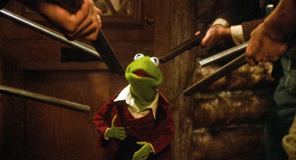 Kermit the Frog surrounded by shotguns 