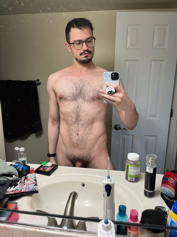 Rip taking a naked selfie in their friend’s bathroom, featuring full bush and tasteful amount of shaft