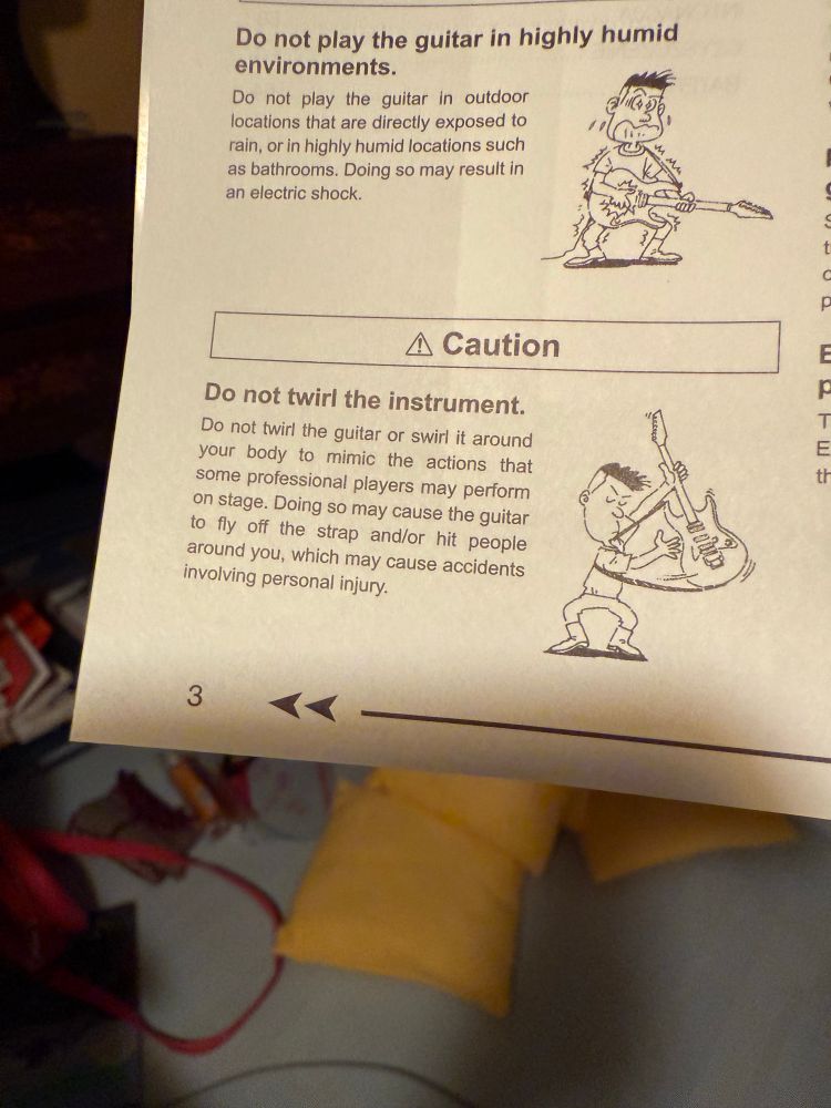 Warning in a guitar user manual not to twirl the guitar around your body by the strap while playing