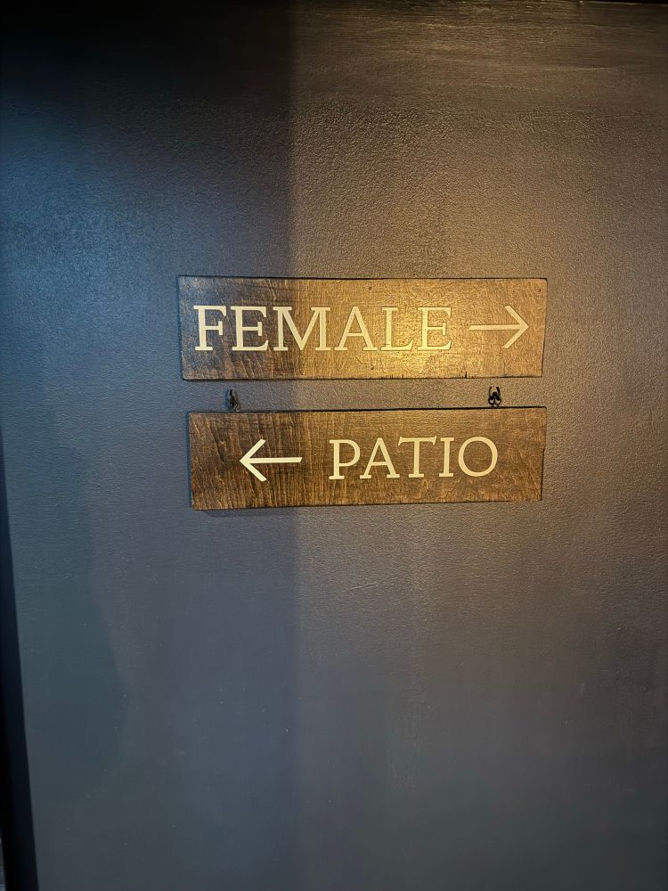 Two signs: FEMALE and PATIO