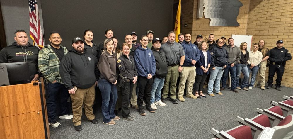 Group of people pose for shot.