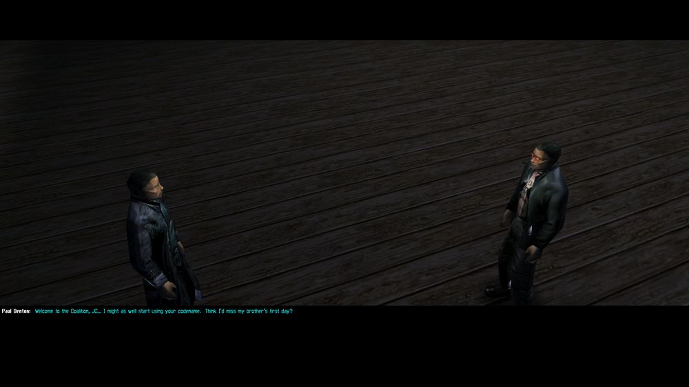 A screenshot from deus ex.  This is the first extended conversation in the game (excluding training) where JC Denton's brother Paul is congratulating his brother on his first day at work