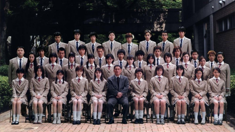 Class picture at the start of Japanese Film Battle Royale (2000) by Kinji Fukasaku adapted from the novel Battle Royale (1999) by Koushun Takami