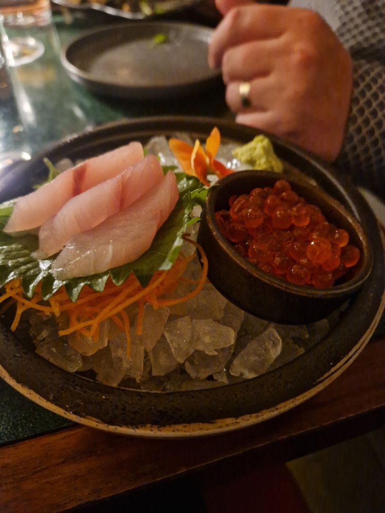 Kingfish sashimi and ikura (salmon roe) on ice