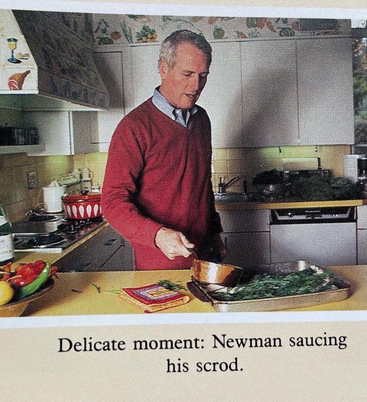 Paul Newman shown saucing his scrod, with the caption "Delicate moment: Newman saucing his scrod."