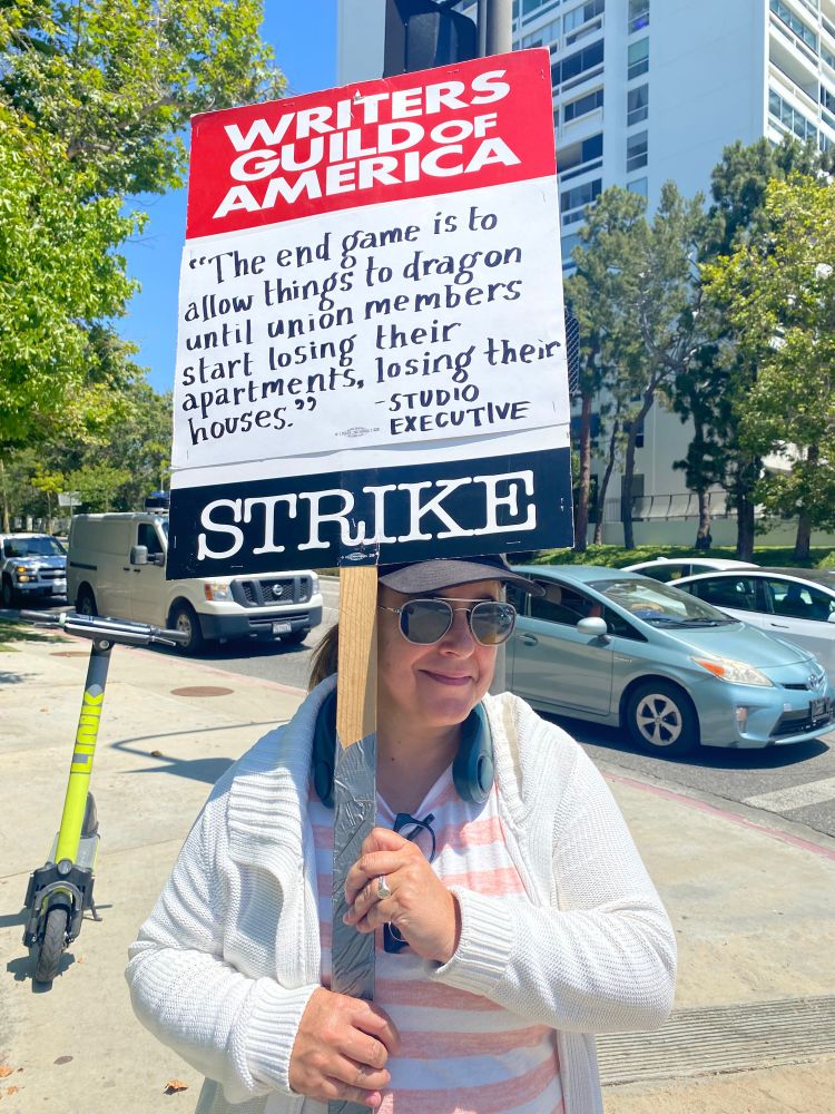 Picketer with strike sign: “The end game is to allow things to drag on until union members start losing their apartments, losing their houses” - studio executive 