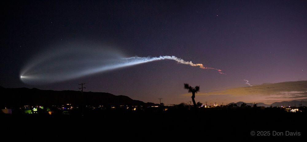 This wide angle photograph, actually a mosaic of two photographs,  shows the July 18 2025 launch from Vandenberg AFB, approximately 250 miles away from my Joshua Tree, California vantage point.
 These twilight launches feature dramatic lighting, and this one was no exception. The initial display of red to yellow to white to blue-white lighting appeared in the early stages as the rocker climbed, and continued to be a major feature of the display. Here the second stage exhaust gases are seen spreading with less resistance from the surrounding air which becomes more rarified as the upper layers of the atmosphere are passed through on the way to orbit. The uppermost plume's color is partly due to the light scattering characteristics of the exhaust gases, and partly due to the 'hard cool white' color of sunlight unfiltered by Earths atmosphere. On the ground the Sunlight is just a bit yellow from atmospheric scattering.