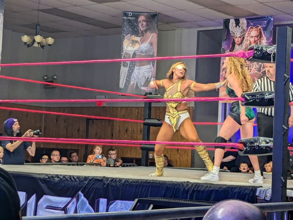 Megan Bayne, left, prepares to punch Maggie Lee in a Dreamwave Women's Title match