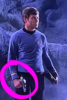 McCoy holding the phaser backwards