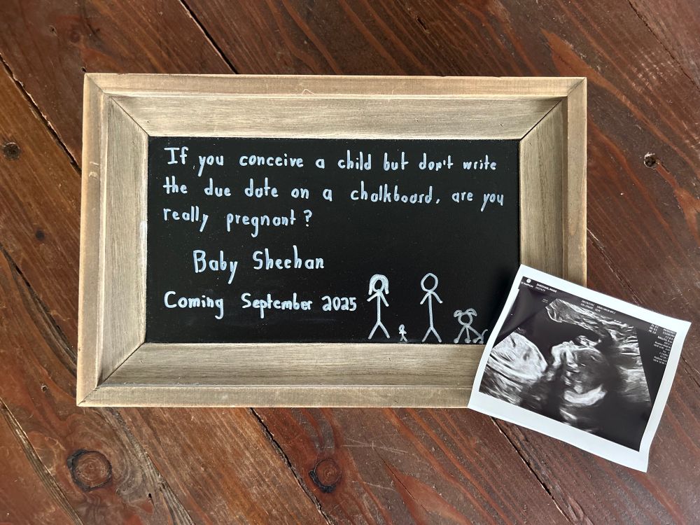 Baby announcement board and sonogram with announcement that Baby Sheehan is due in September