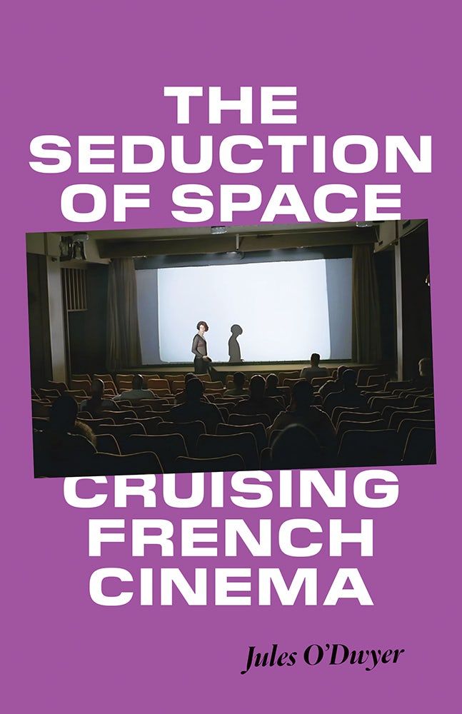 Book cover of The Seduction of Space: Cruising French Cinema by Jules O'Dwyer. Film still of theater interior with sparse patrons watching a person before a white screen. Around still is white text on purple field.