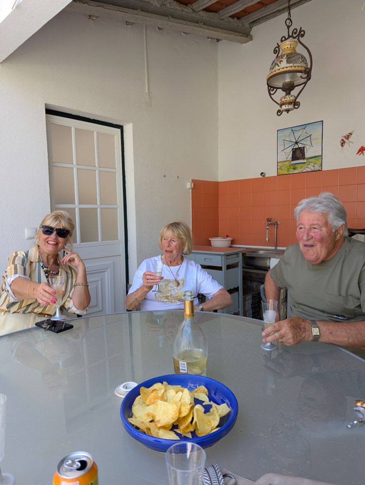 Realtor and couple toasting the sale