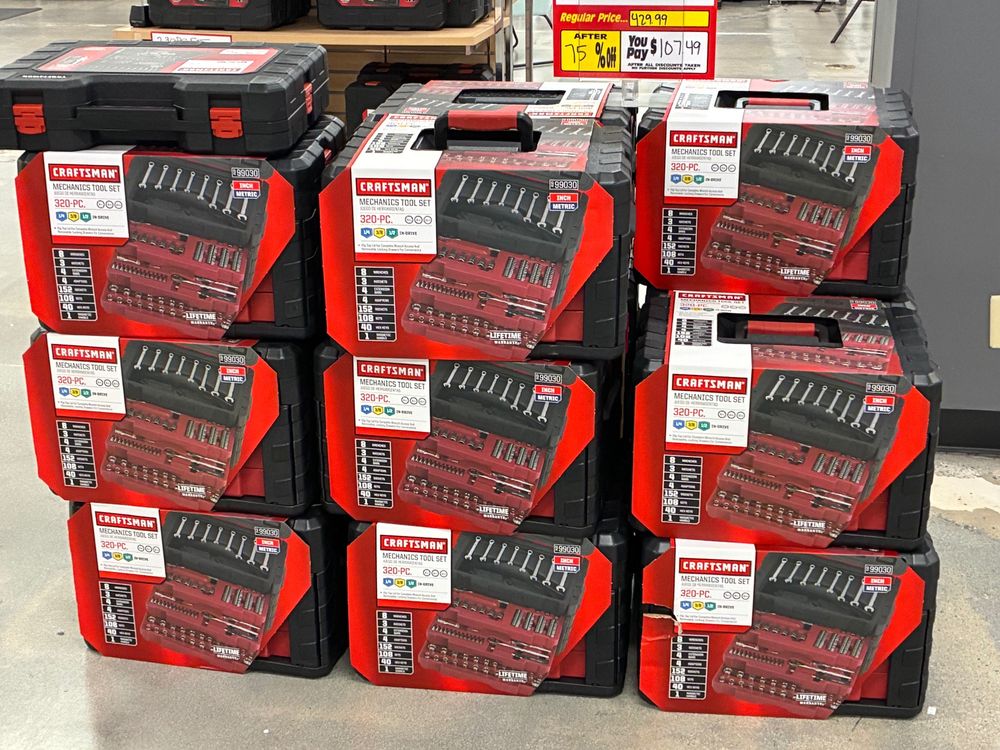 A stack of Craftsman 320-piece sets for sale from $429.99 to $107.49 at a Sears, stacked three high with one missing.