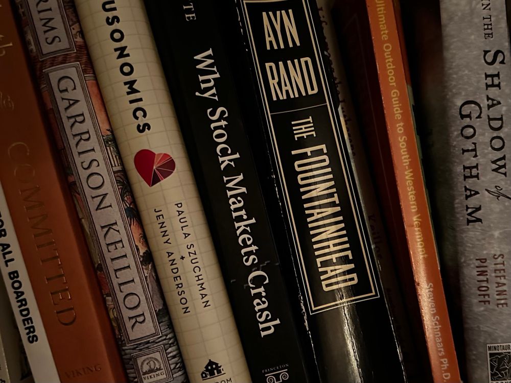 Books on shelf:  Why Stockmarkets Crash, right next to The Fountainhead 