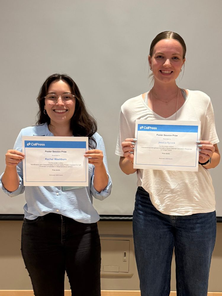 Rachel Washburn and Jessica Aycock with their Cell Press poster awards at GRC Microbial Adhesion and Signal Transduction