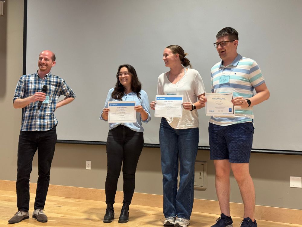 Michael Patnode with Rachel Washburn, Jessica Aycock, and Mason Clark, winners of GRC MAST poster awards from Cell Press and FEMS
