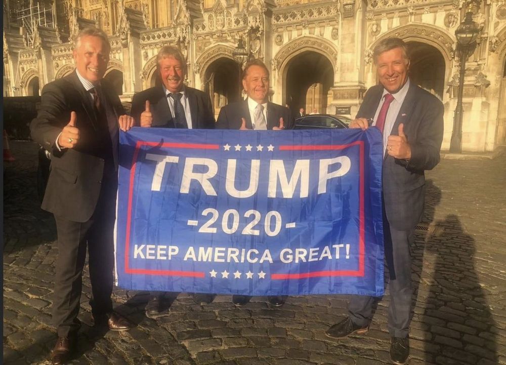 DUP MPs inc Wilson with Trump 2020 banner