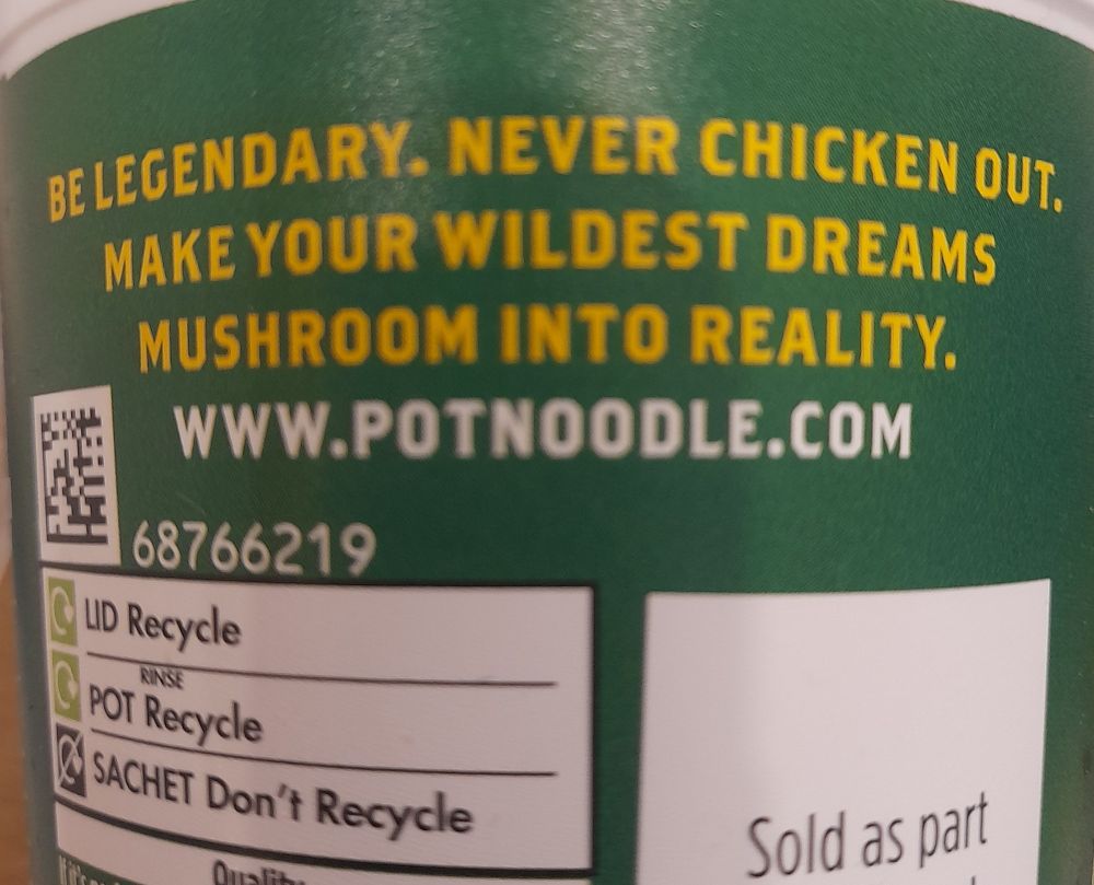 A pot noodle container bearing the words 'be legendary.  Never chicken out. Make your wildest dreams mushroom into reality.'