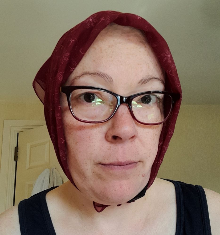 Me with scarf covering my scalp and tied under my chin
