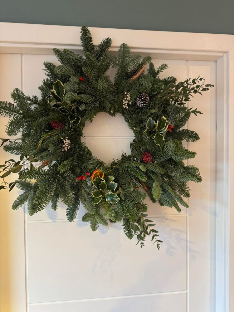 A Christmas wreath made entirely with supplies purchased at Da Potting shed.