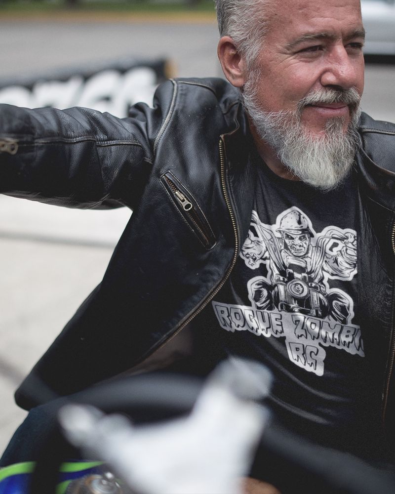A shirt mock up of a ROGUE zombie riding a motorcycle for a motorcycle club