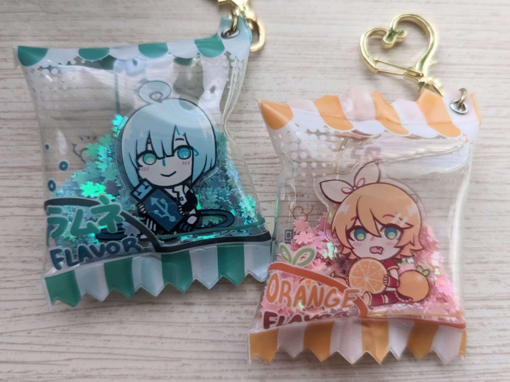 Fanmade candy charms of Utatane Piko and Kagamine Rin. Piko is ramune-themed and Rin's is orange-themed.