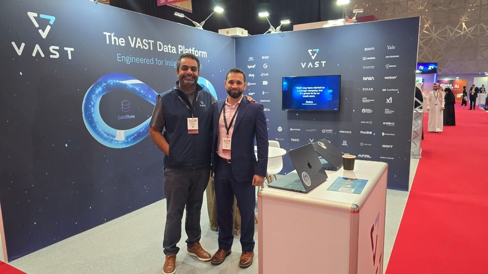 Shams and Youssef of VAST Data on stand in Qatar at the World Summit of AI in Doha