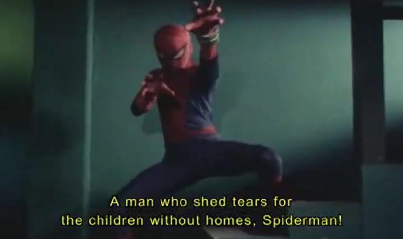 Screenshot from the 1978 Japanese Spiderman, with Spiderman posting with yellow text that reads "A man who sheds tears for the children without homes, Spiderman!"