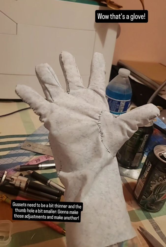 Picture of a fabric glove mock up. There is text that says, "Wow that's a glove! Gussets need to be a bit thinner and the thumb hole a bit smaller. Gonna make those adjustments and make anither!"