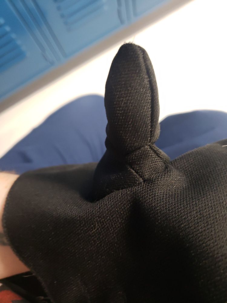 Picture of a thumb gusset on a black glove