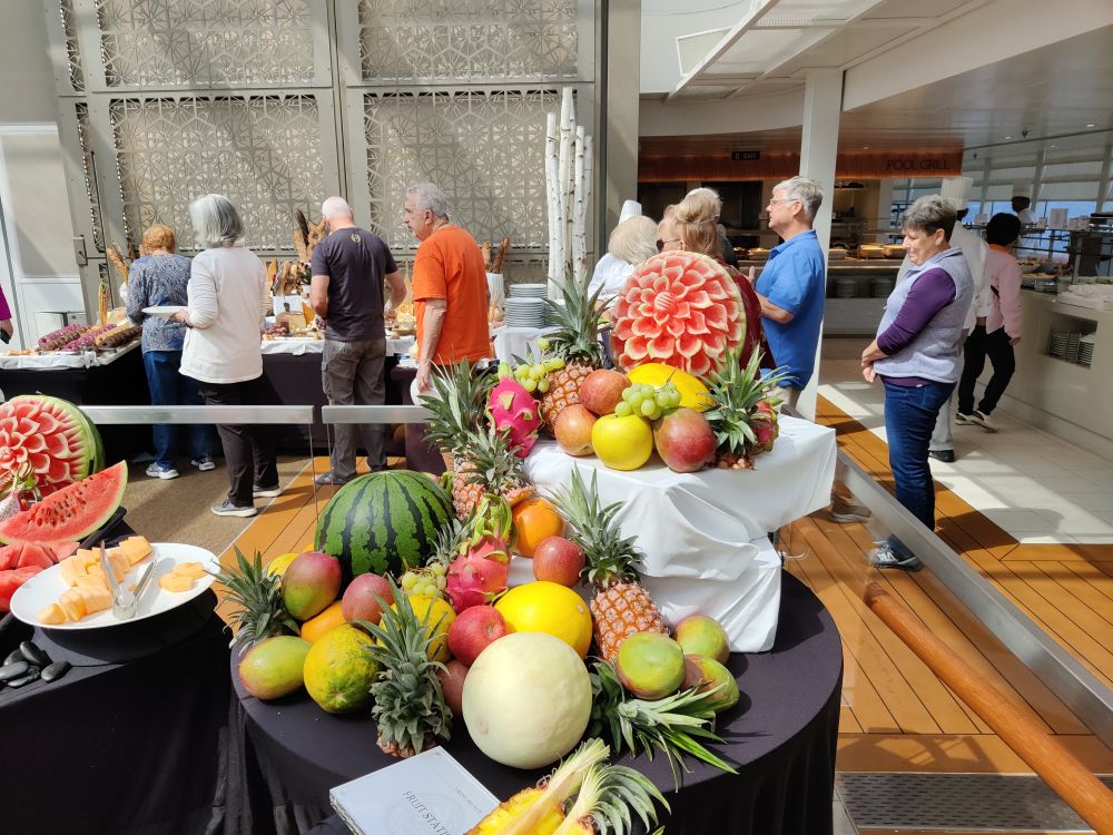 The fruit end of the brunch dessert offering, with lots of melon and an intricately carved watermelon on display