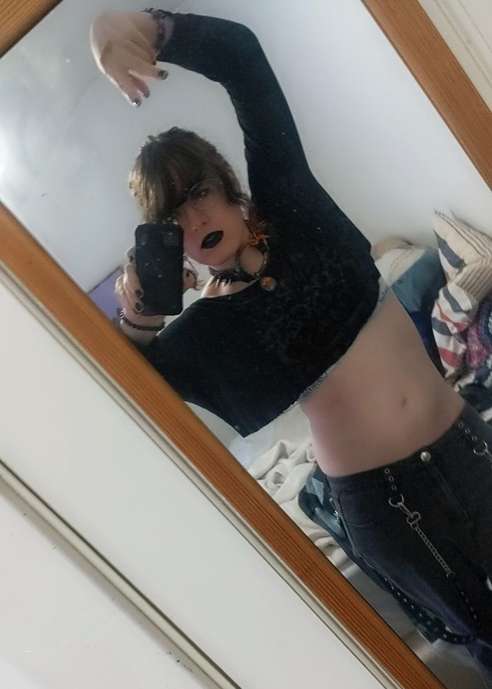 aster posing stupid style in black clothes at an angle