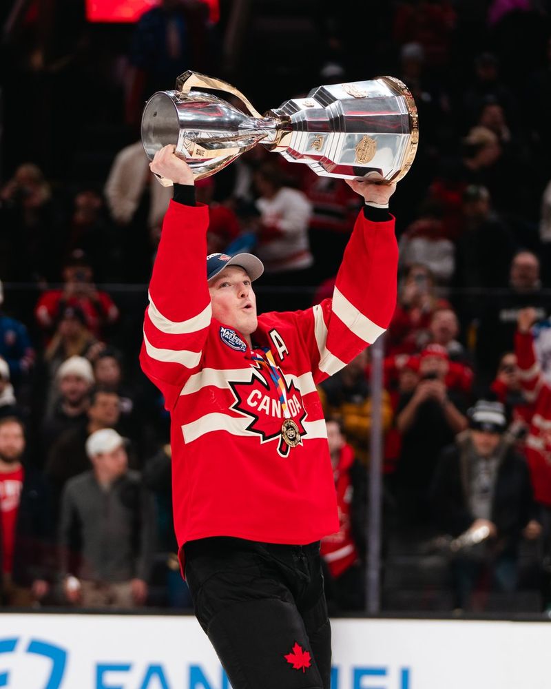 Cale Makar holding up the trophy
