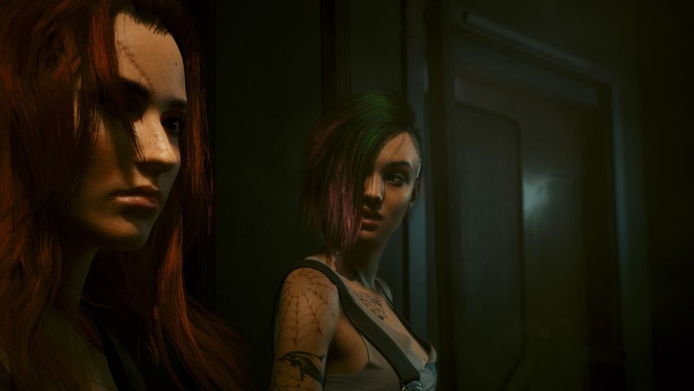 A femme V with auburn hair stands in profile in a dark corner of a megabuilding. Beside them, Judy looks back at them somewhat bewildered , very cute. Hair is hairing. 