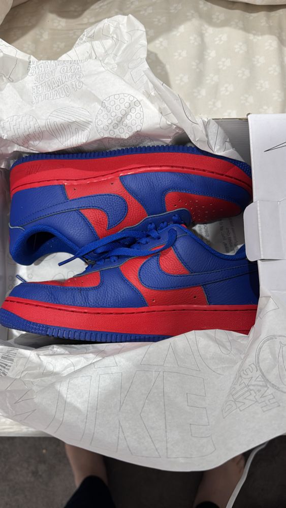 Red and navy MFC inspired Nike trainers. 