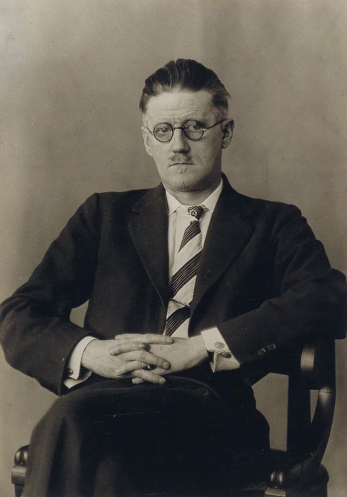 Irish author James Joyce wearing glasses and a moustache 