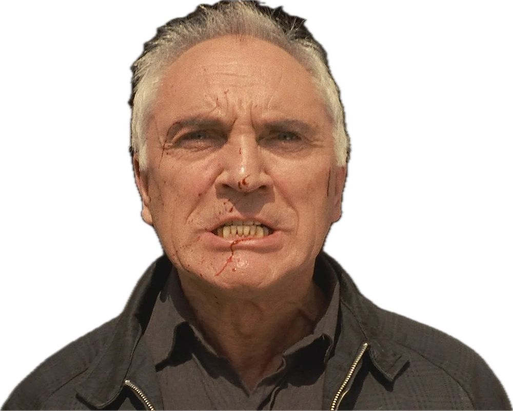 Terence Stamp in The Limey with blood on his face